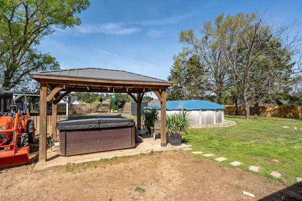 a view of swimming pool with an outdoor seating