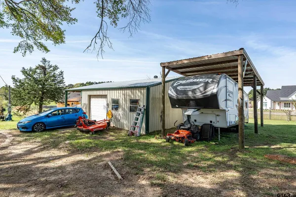 a view of a car parked in front of a house