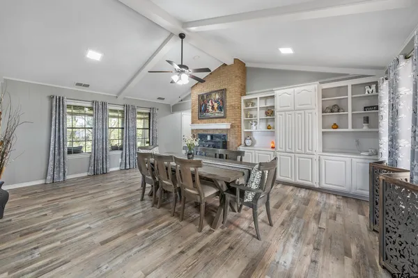 a view of a dining room with furniture and window