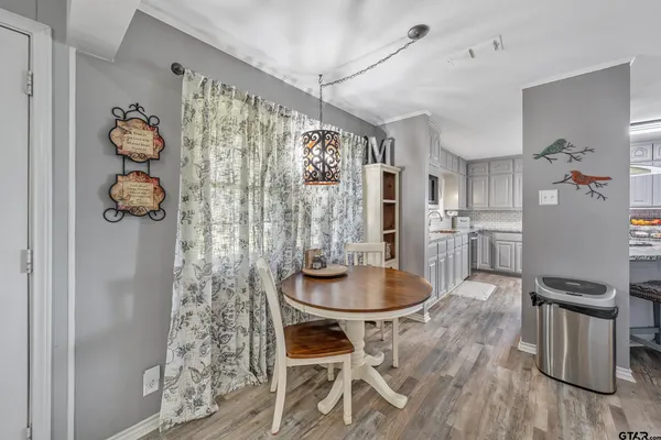 a dining room with furniture and window