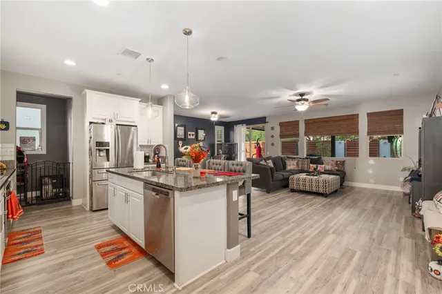 a kitchen with stainless steel appliances granite countertop lots of counter top space