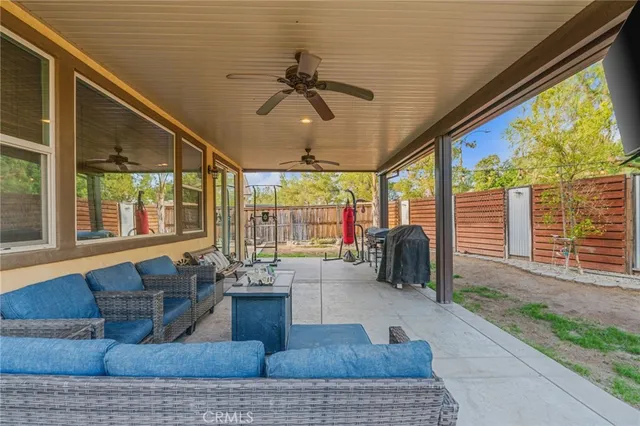 a living room with couch and large windows