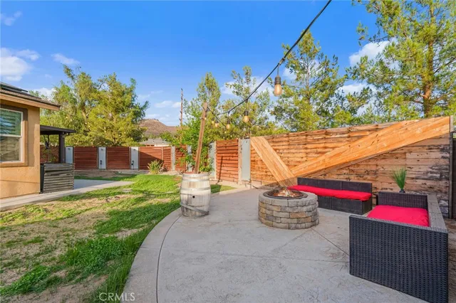 a house view with a sitting space and garden