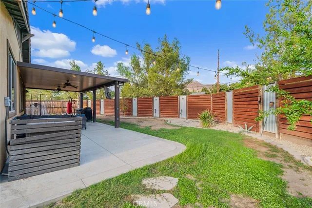 a view of a backyard with a patio