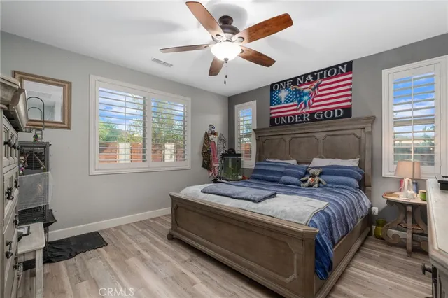 a bedroom with bed and a window