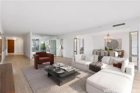 a living room with furniture or couch and a wooden floor
