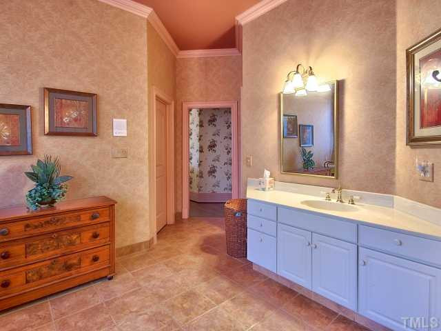 14412 Possum Track Road Raleigh, NC 27614 - Photo 10 of 25 Large master bath with 2 walk in closets. Notice the upgraded tile thru-out bath. Master Bath/Spa