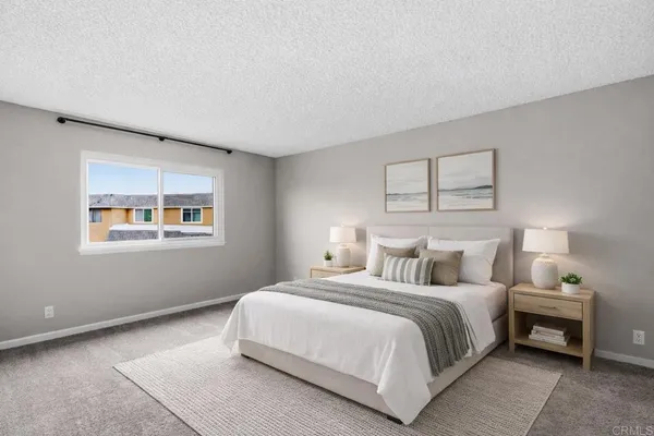 a bedroom with a bed and night stand