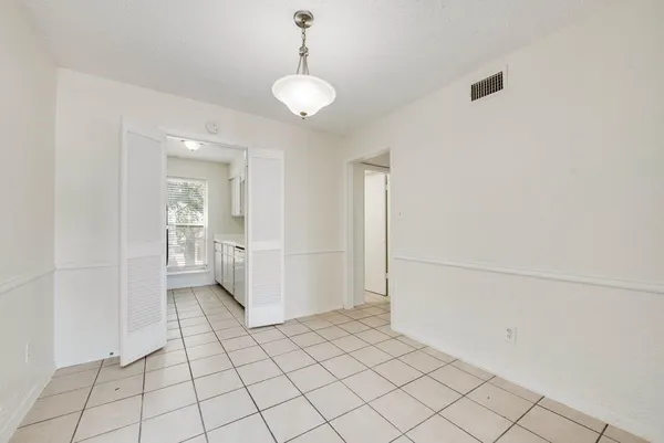 a view of a room with white walls