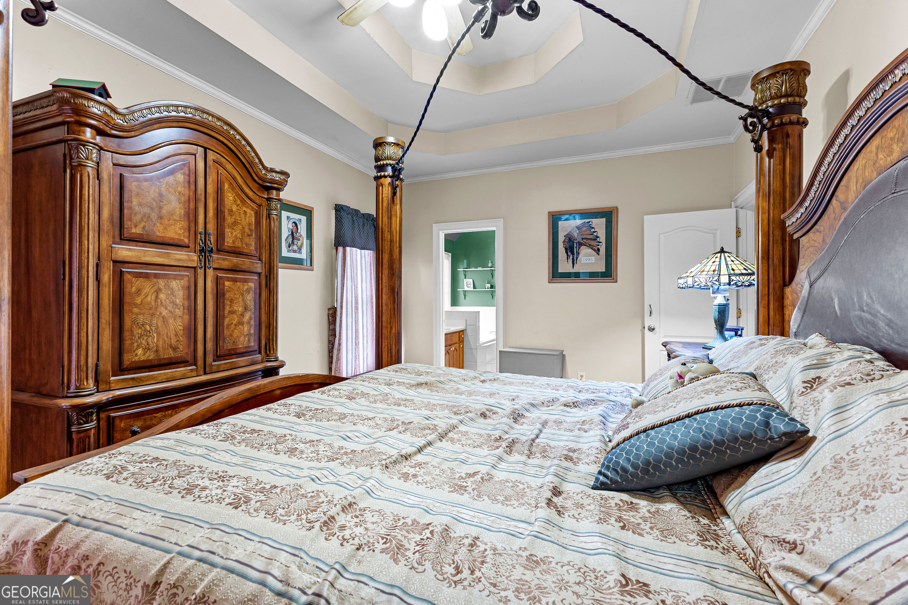 502 North Rover Road Williamson, GA 30292 - Photo 38 of 46 a bedroom with a bed and a chandelier
