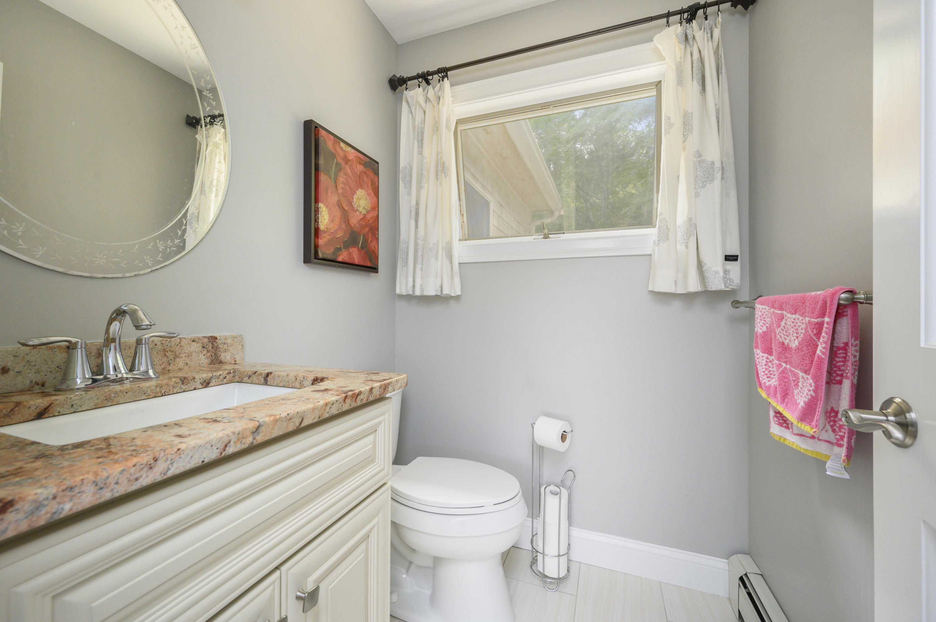 60 Truro Center Road Truro, MA 02666 - Photo 13 of 30 a bathroom with a granite countertop sink mirror vanity and toilet