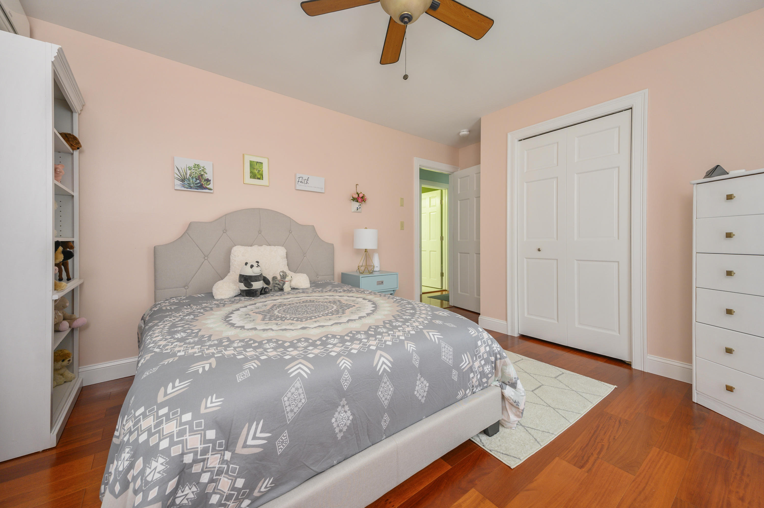 60 Truro Center Road Truro, MA 02666 - Photo 15 of 30 a bedroom with a bed and wooden floor