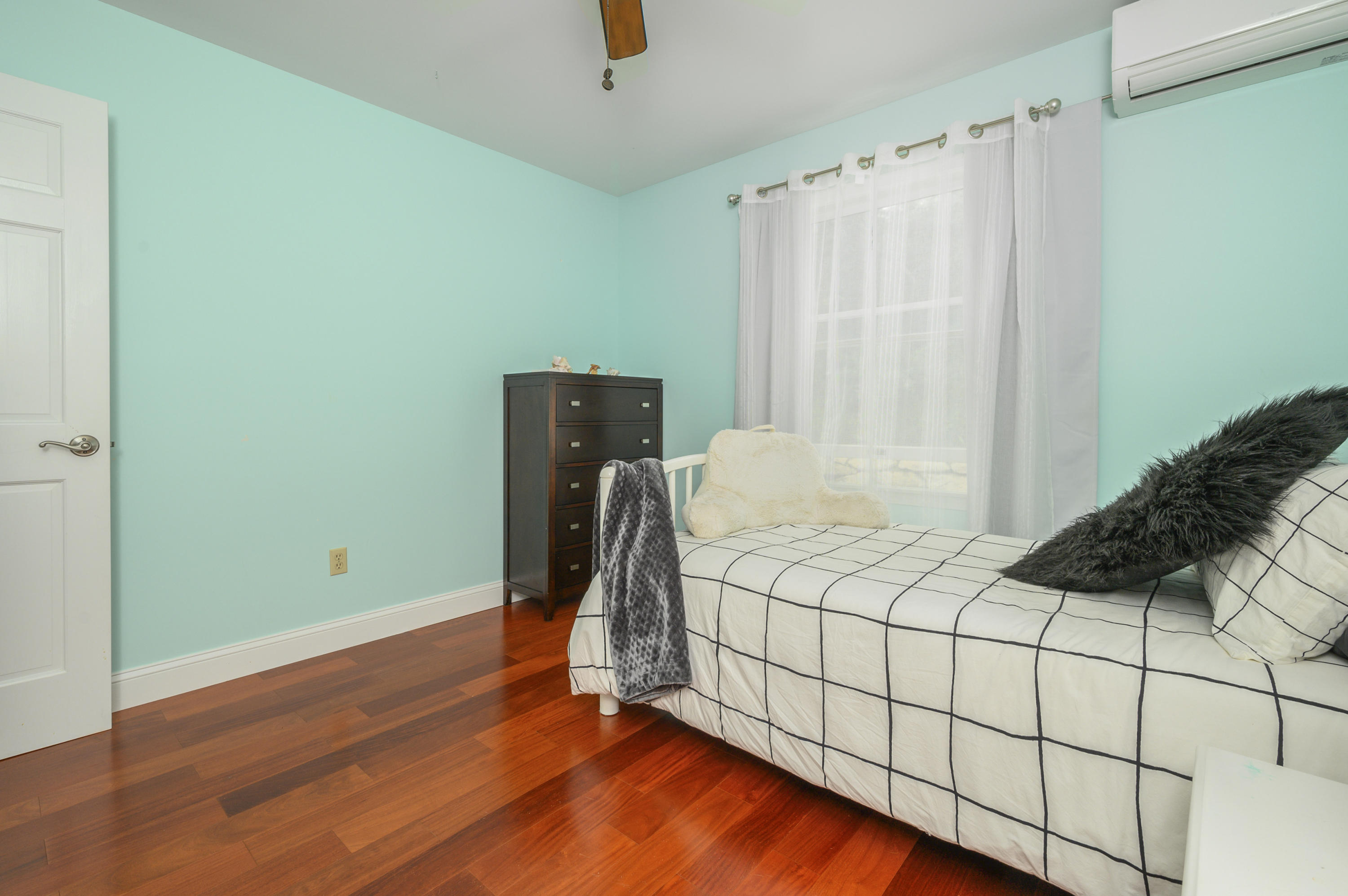 60 Truro Center Road Truro, MA 02666 - Photo 17 of 30 a bedroom with a bed and a window