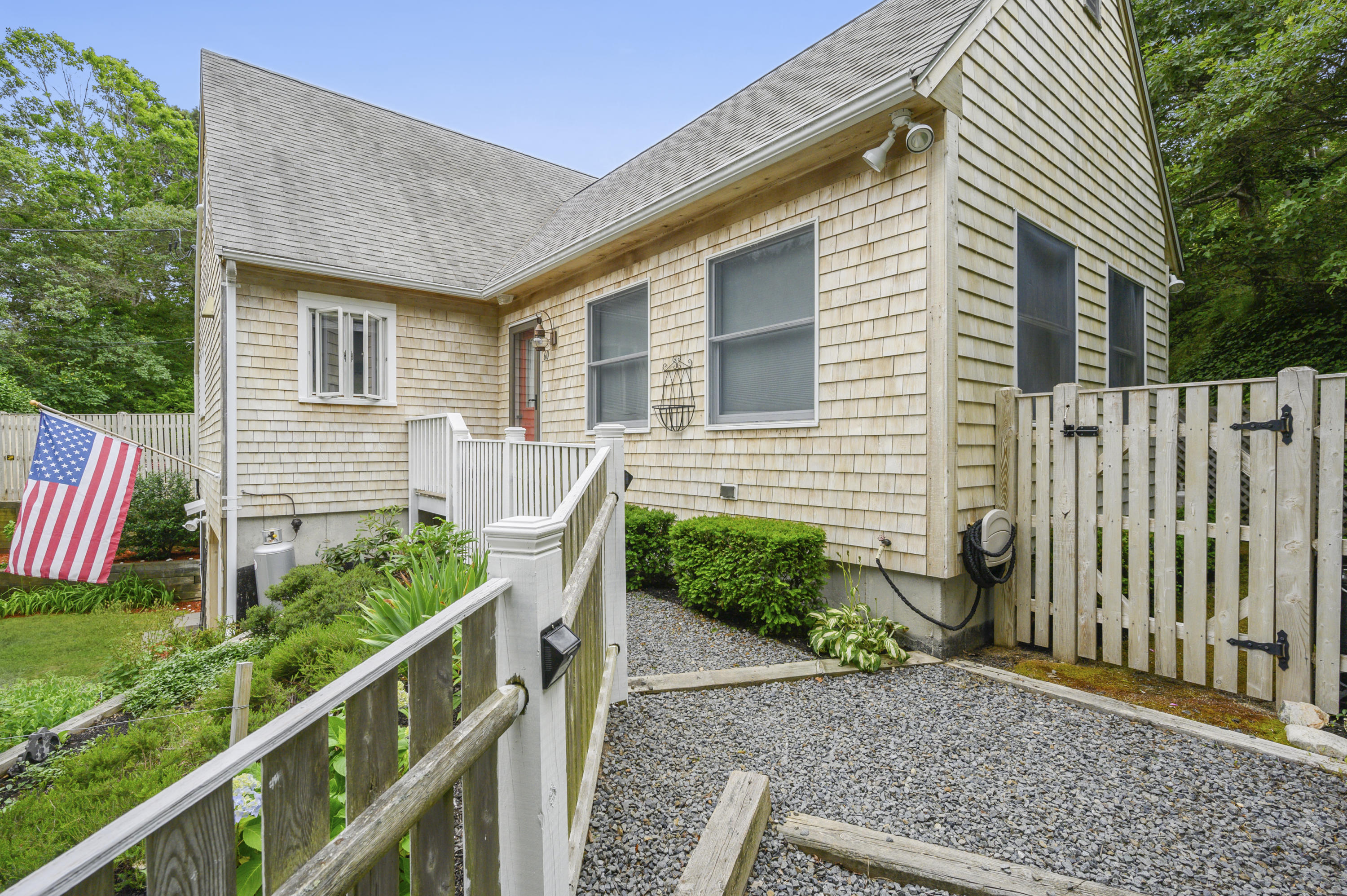 60 Truro Center Road Truro, MA 02666 - Photo 2 of 30 a front view of a house with a yard