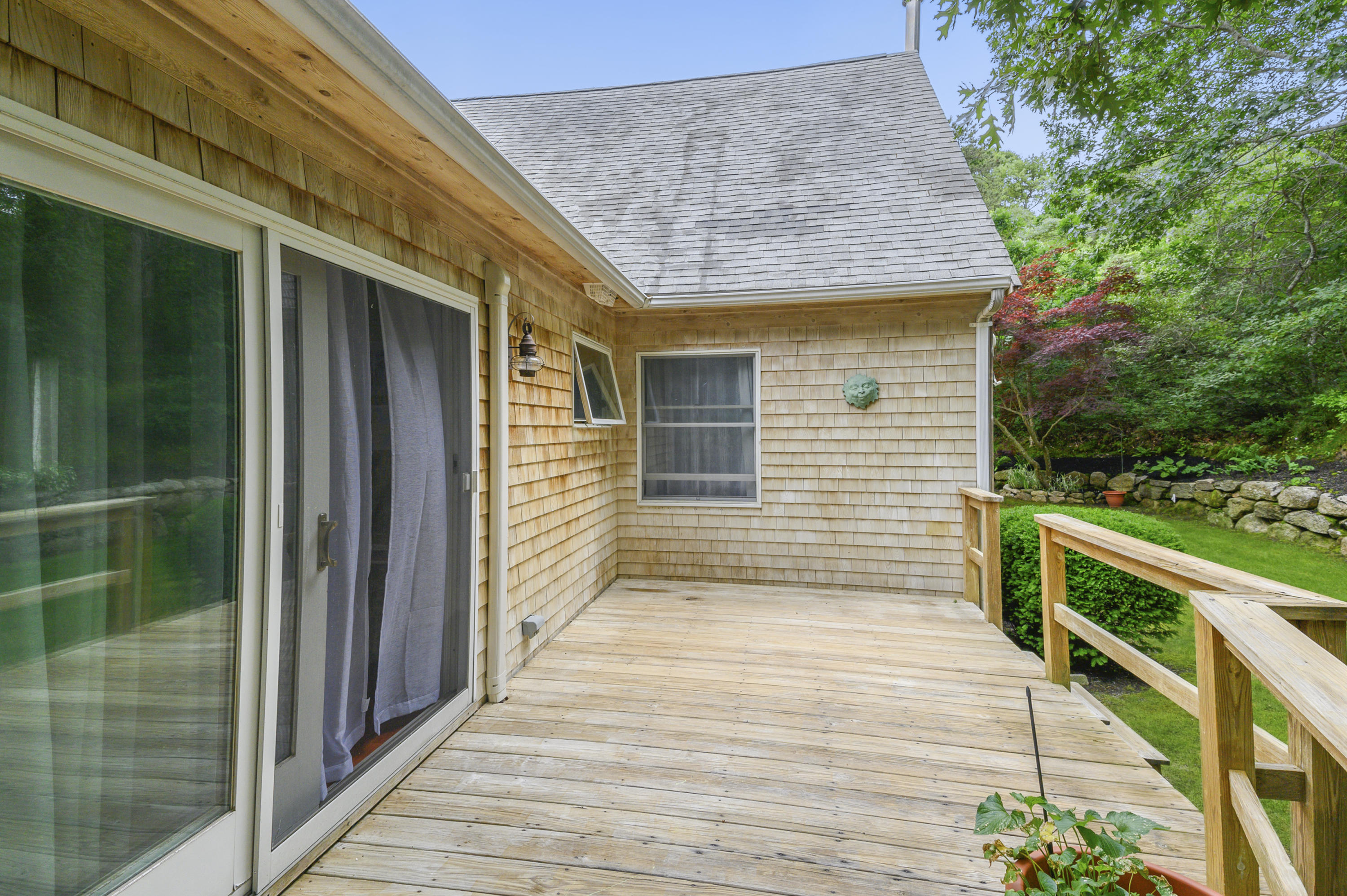 60 Truro Center Road Truro, MA 02666 - Photo 23 of 30 a view of a balcony with wooden floor and stairs