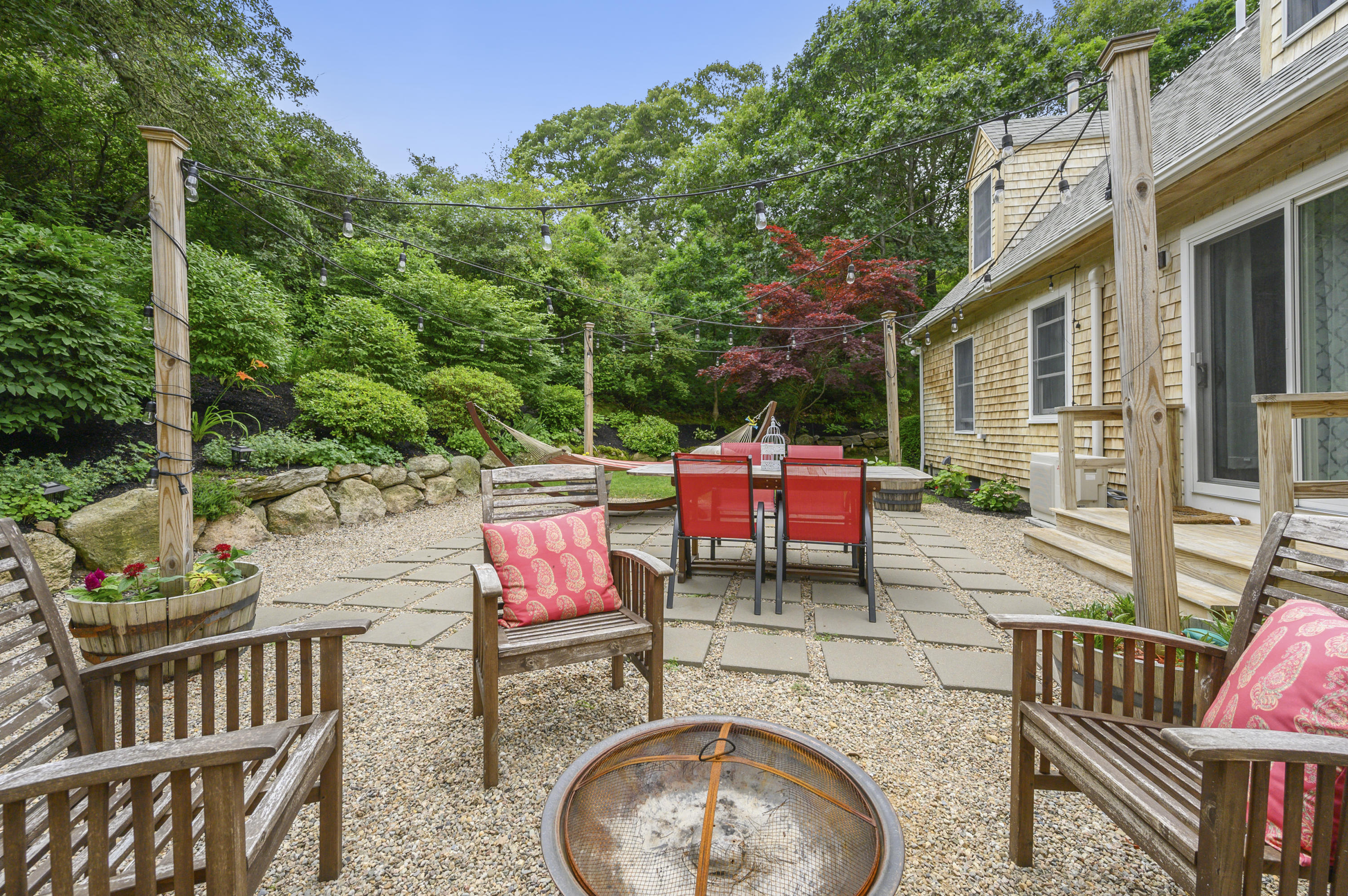 60 Truro Center Road Truro, MA 02666 - Photo 26 of 30 an outdoor sitting area with furniture and garden view