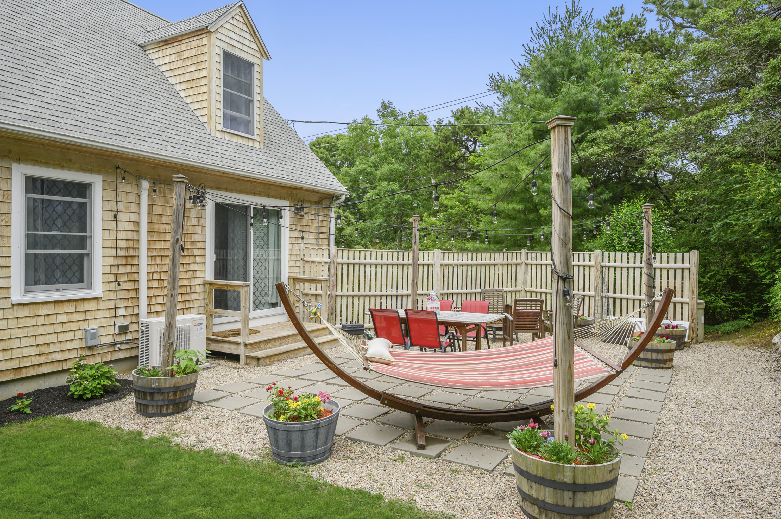 60 Truro Center Road Truro, MA 02666 - Photo 27 of 30 a view of a balcony with chair and potted plants