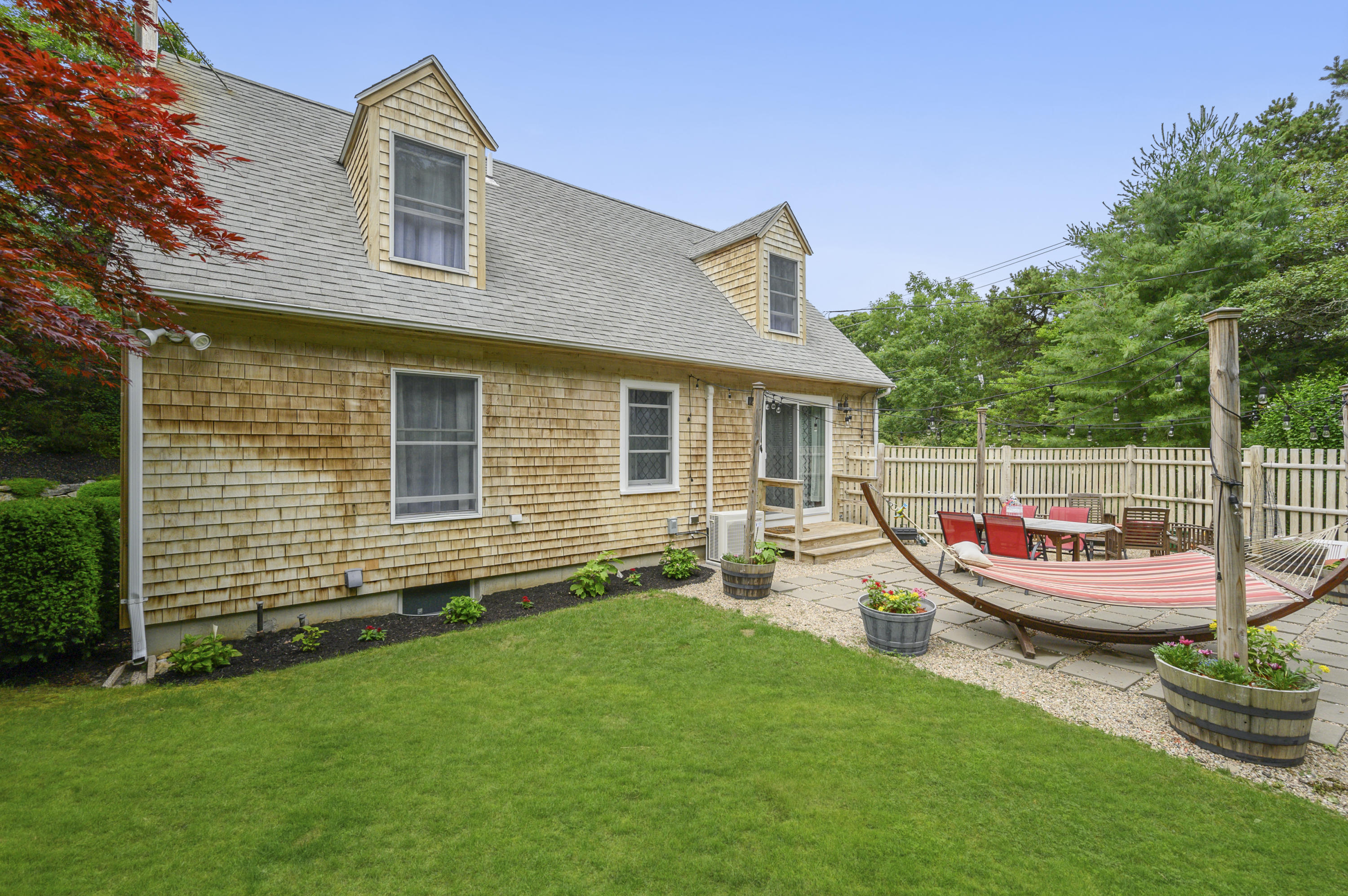 60 Truro Center Road Truro, MA 02666 - Photo 29 of 30 a view of a house with backyard and sitting area