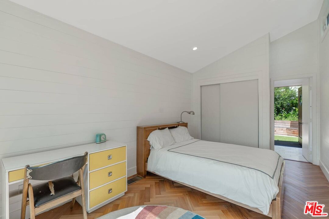 249 Paradise Cove Road Malibu, CA 90265 - Photo 25 of 41 a bedroom with a bed and a dresser