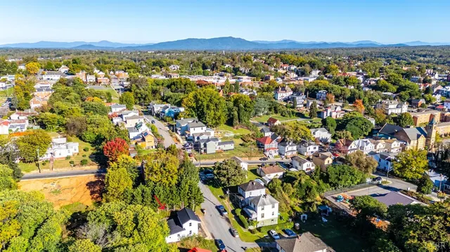 a view of a city with mountains in the background