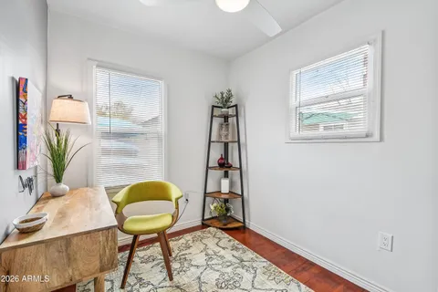 a bedroom with a bed and a dresser