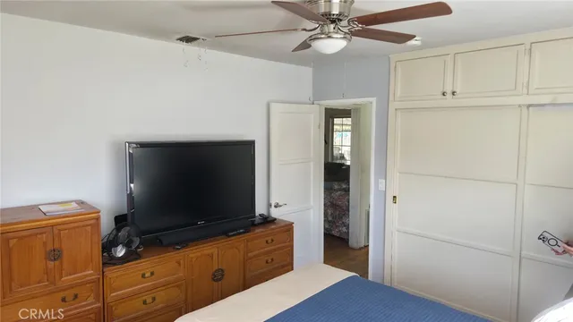 a living room with furniture and flat screen tv