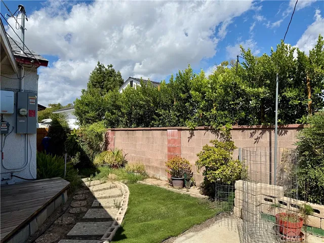 a view of a backyard with sitting area