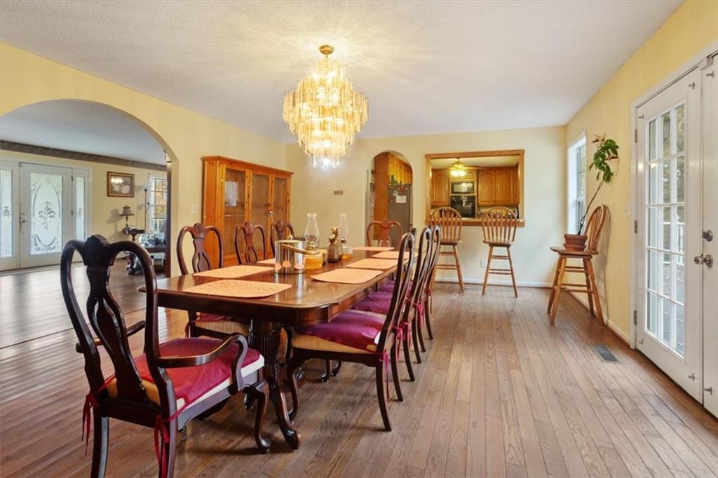 871 Robinson Road Chatsworth, GA 30705 - Photo 11 of 25 a view of a dining room with furniture and chandelier