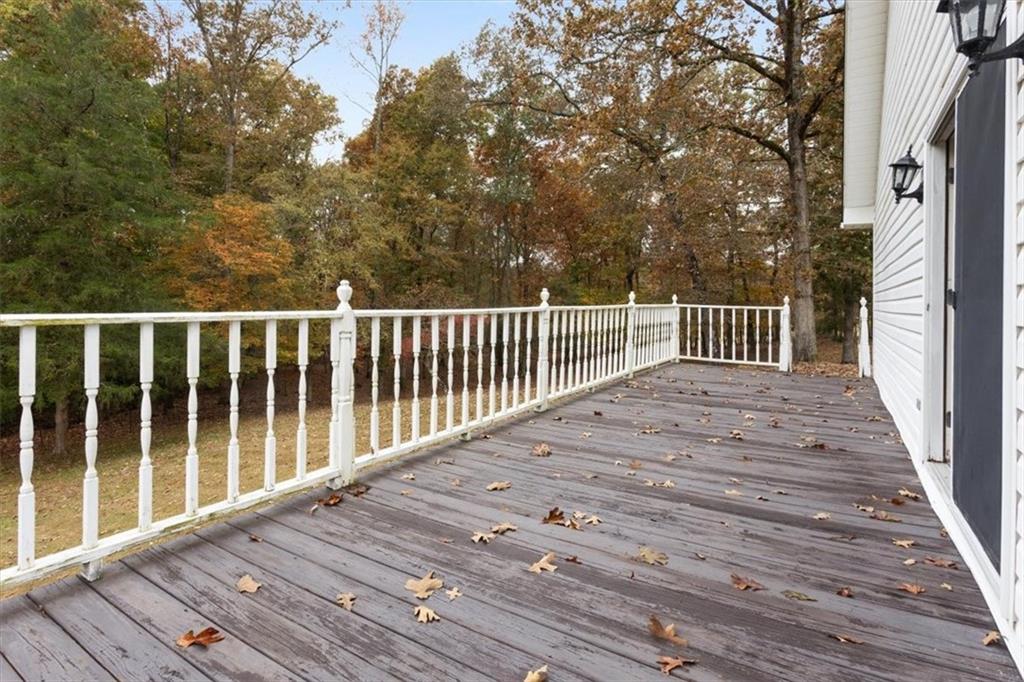 871 Robinson Road Chatsworth, GA 30705 - Photo 19 of 25 a balcony with wooden floor and fence