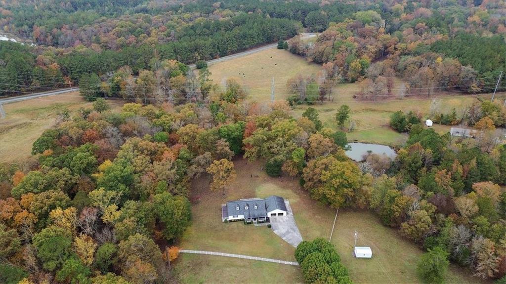 871 Robinson Road Chatsworth, GA 30705 - Photo 2 of 25 an aerial view of a house with a yard and lake view