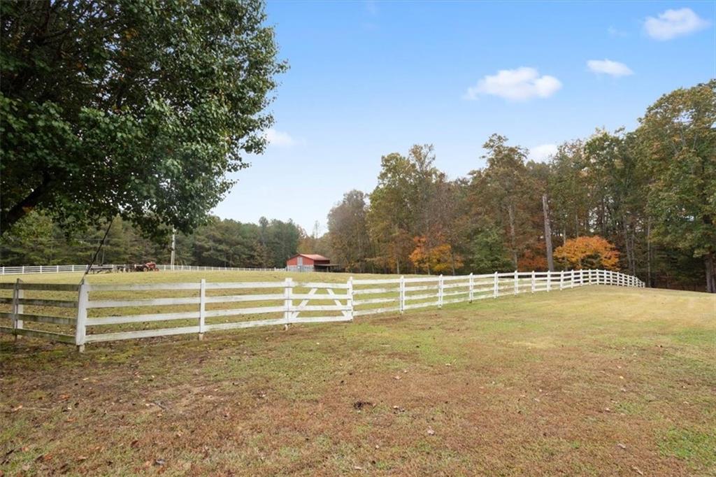 871 Robinson Road Chatsworth, GA 30705 - Photo 21 of 25 a view of a swimming pool with an outdoor space and seating area