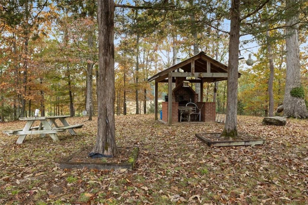 871 Robinson Road Chatsworth, GA 30705 - Photo 22 of 25 a front view of a house with a yard