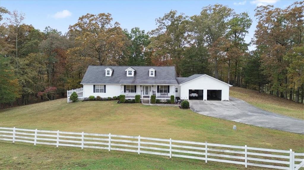 871 Robinson Road Chatsworth, GA 30705 - Photo 6 of 25 a front view of a house with a garden