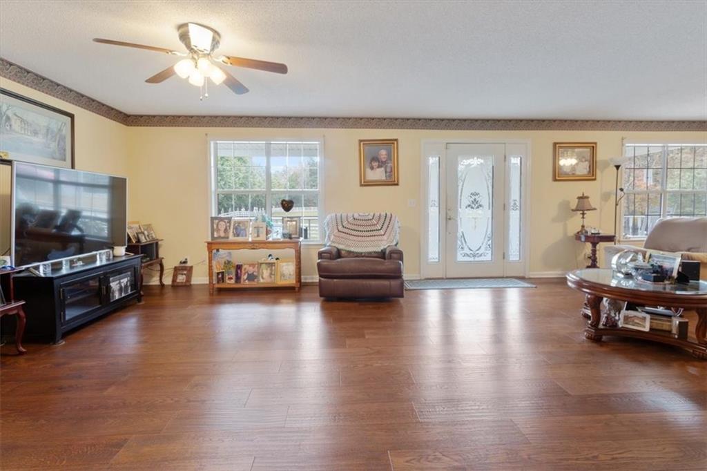 871 Robinson Road Chatsworth, GA 30705 - Photo 10 of 25 a living room with furniture and a flat screen tv