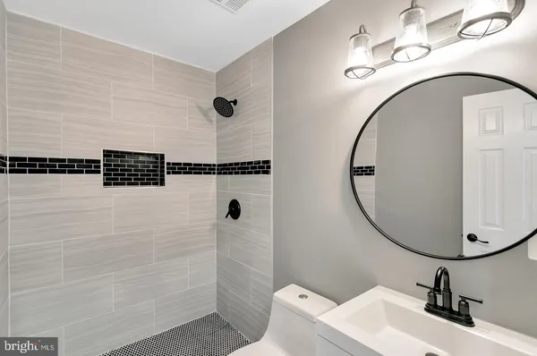 a bathroom with a sink and mirror
