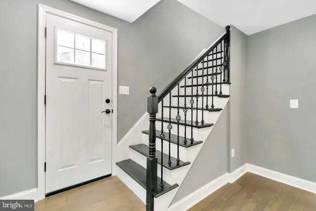 a view of entryway with wooden floor