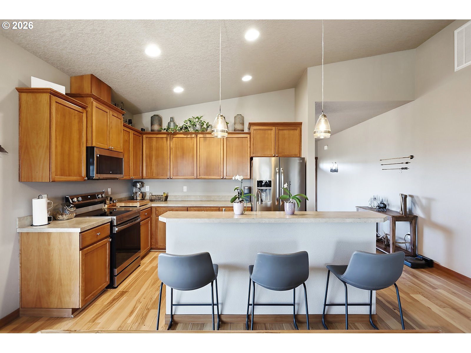 206 Old Mountain Road Goldendale, WA 98620 - Photo 15 of 46 a kitchen with stainless steel appliances kitchen island granite countertop a stove top oven a sink a dining table and chairs