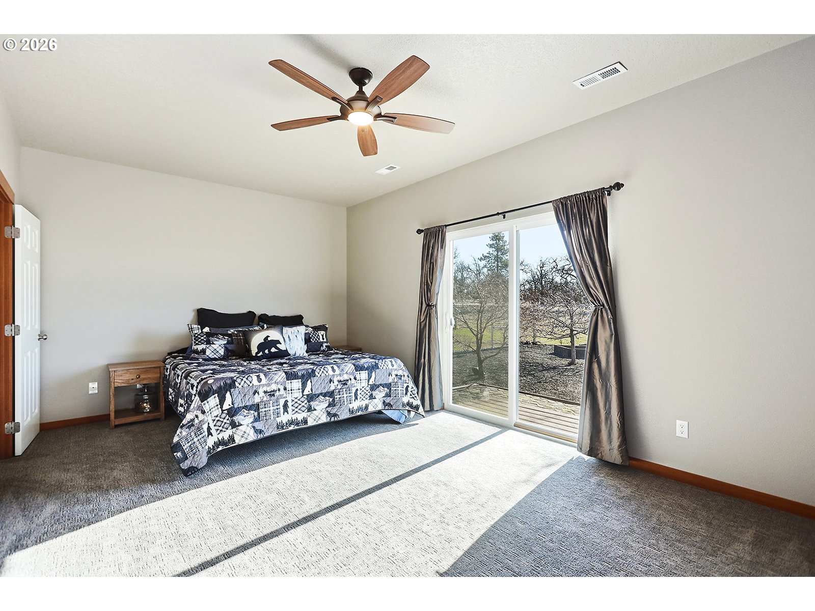 206 Old Mountain Road Goldendale, WA 98620 - Photo 19 of 46 a bedroom with a bed and a large window