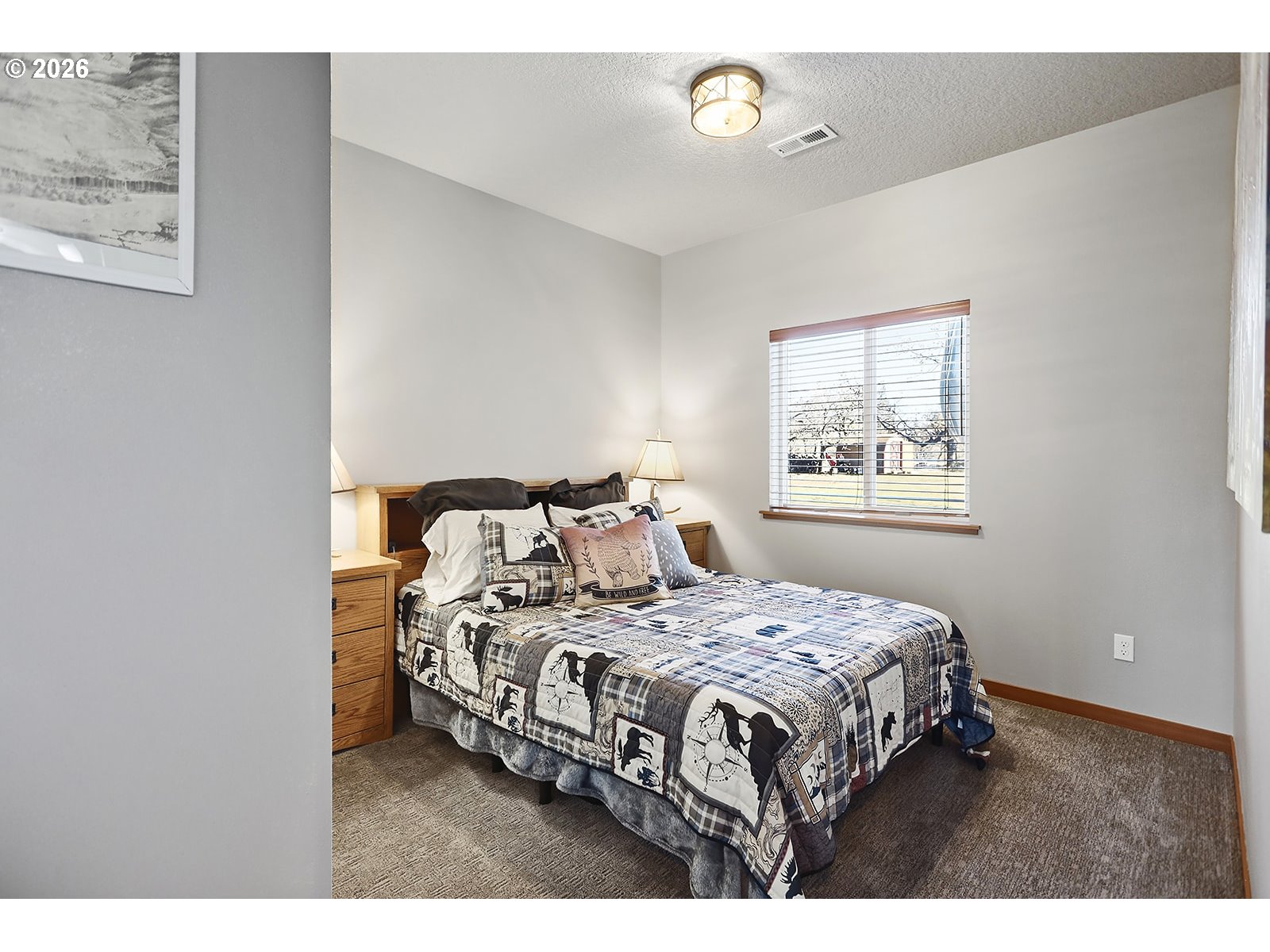 206 Old Mountain Road Goldendale, WA 98620 - Photo 25 of 46 a bedroom with a bed and a painting on the wall