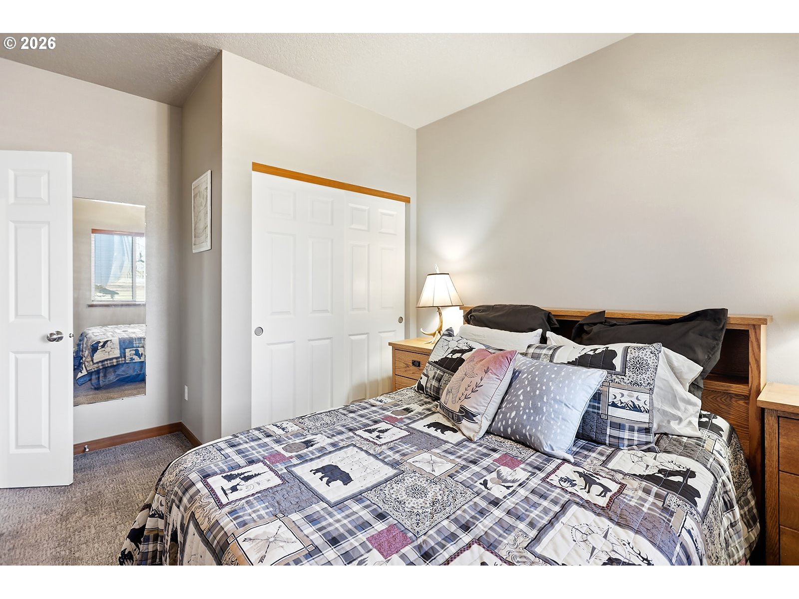 206 Old Mountain Road Goldendale, WA 98620 - Photo 26 of 46 a bedroom with a bed and a mirror