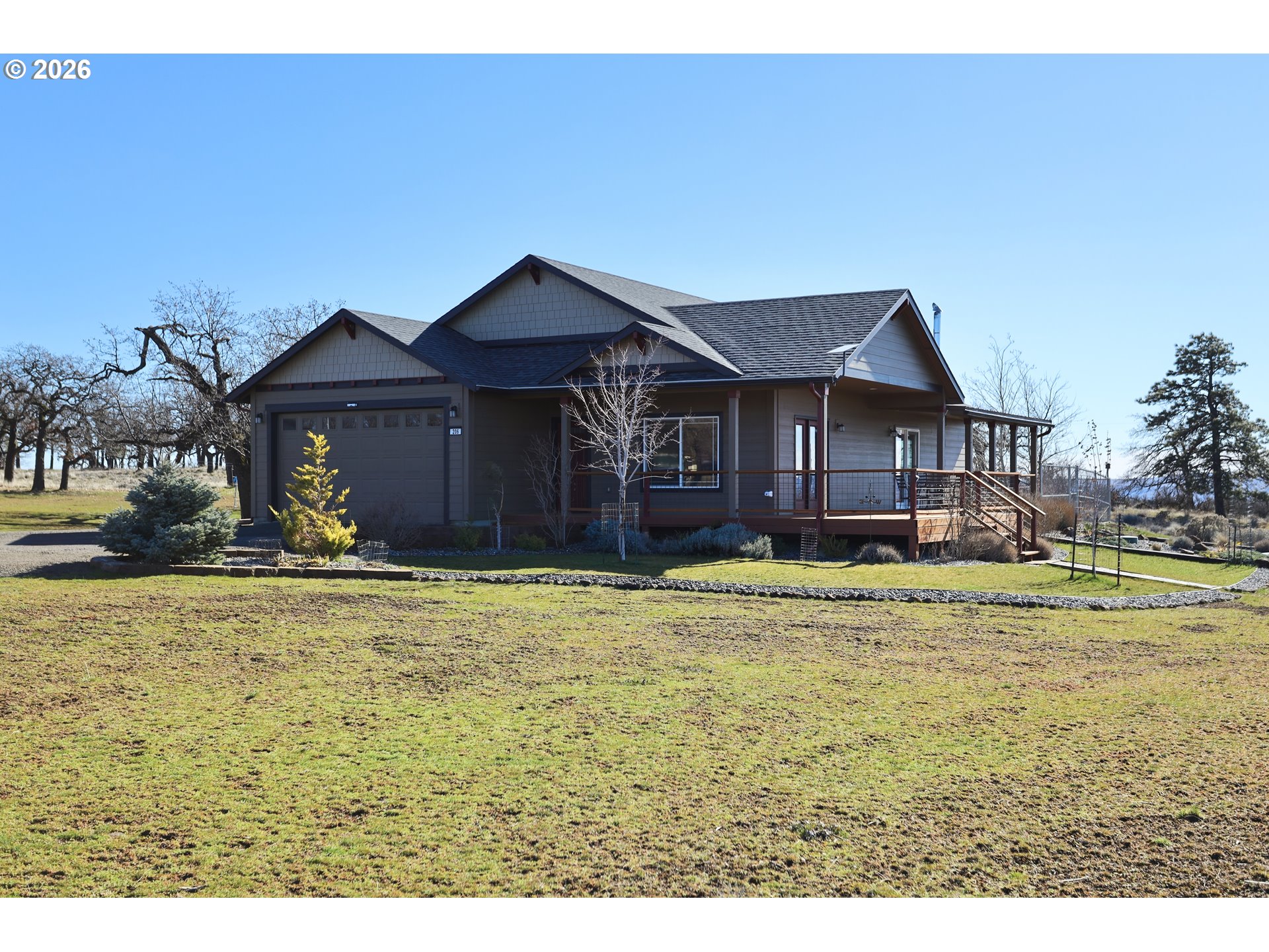 206 Old Mountain Road Goldendale, WA 98620 - Photo 4 of 46 a view of a house with a big yard and large trees
