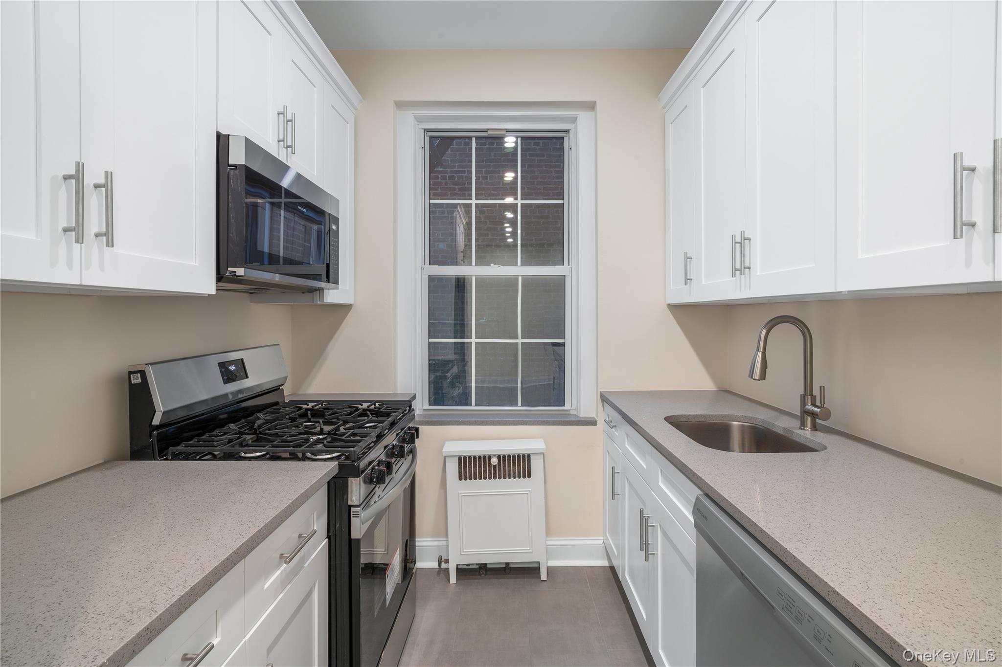 110-07 73rd Road, Unit 3K Queens, NY 11375 - Photo 13 of 21 a kitchen that has a sink and a stove