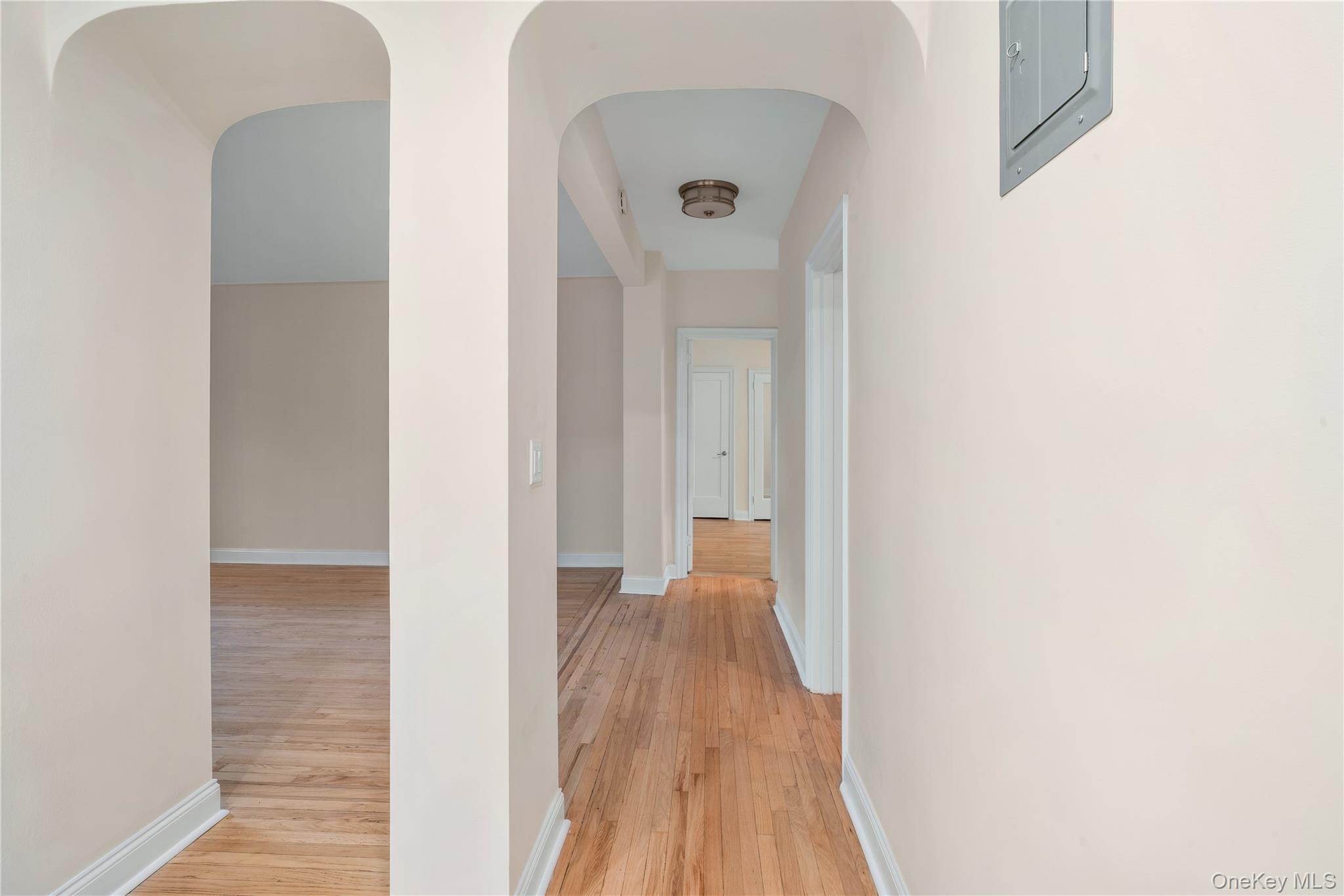 110-07 73rd Road, Unit 3K Queens, NY 11375 - Photo 5 of 21 a view of a hallway with wooden floor