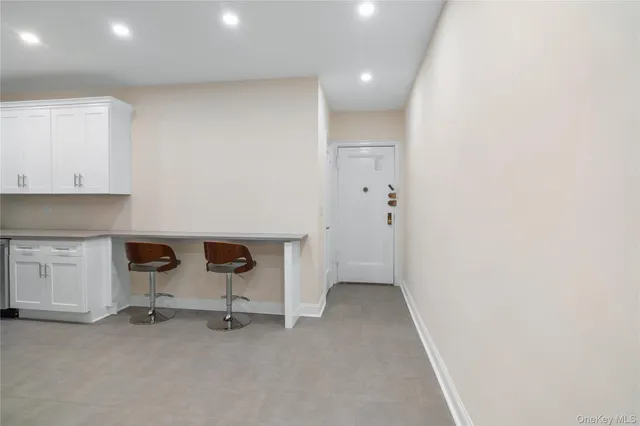 a view of an empty room with a fireplace