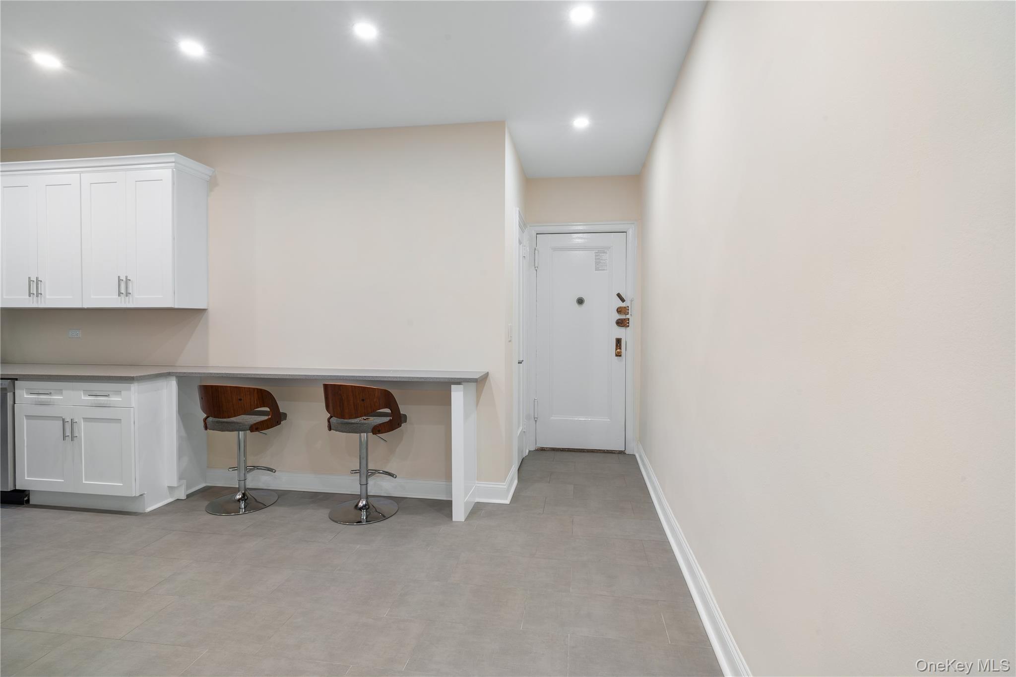 110-07 73rd Road, Unit 3K Queens, NY 11375 - Photo 10 of 21 a view of an empty room with a fireplace