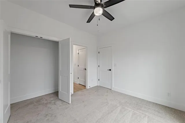 a view of staircase with railing and a window