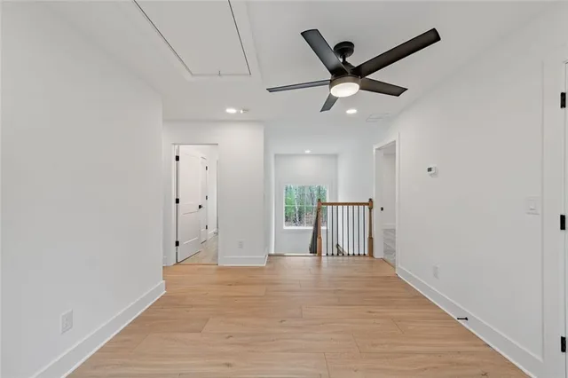 a view of balcony with floor to ceiling windows with wooden floor