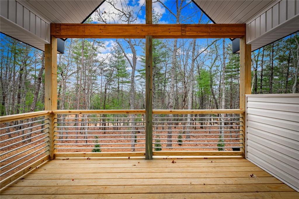 56 Running Brooke Court Morganton, GA 30560 - Photo 32 of 46 a view of balcony with floor to ceiling windows with wooden floor