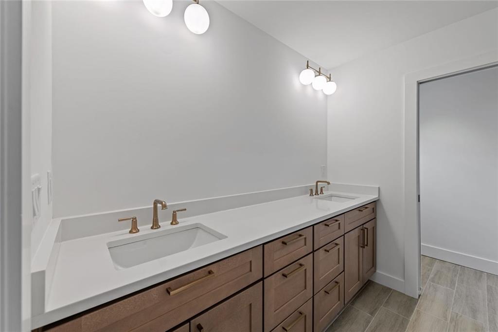 56 Running Brooke Court Morganton, GA 30560 - Photo 35 of 46 a bathroom with a double vanity sink and a mirror