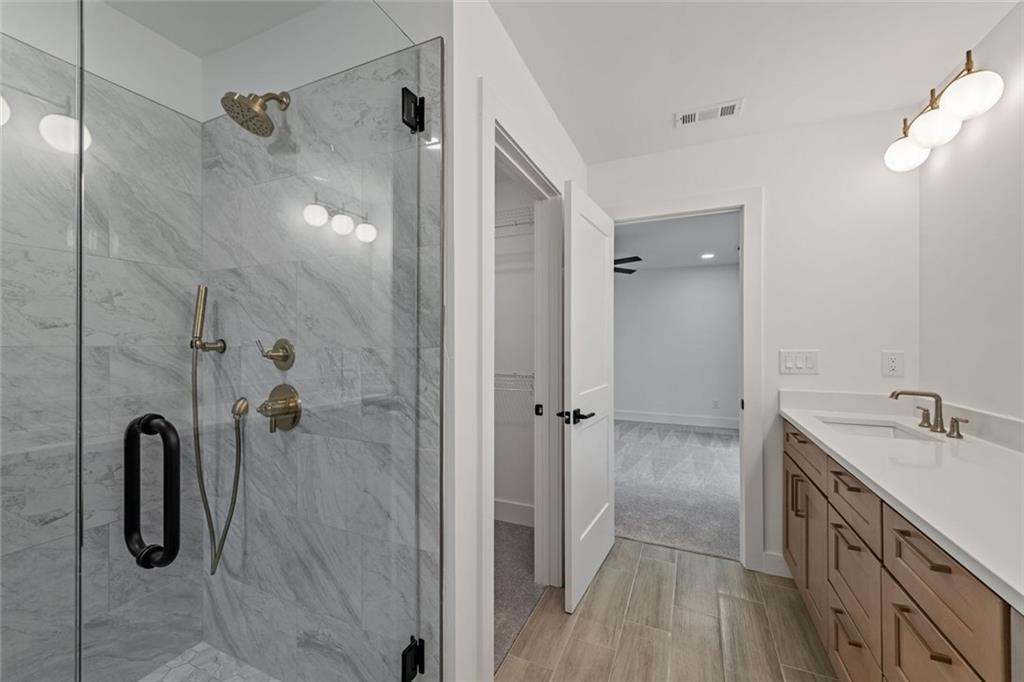 56 Running Brooke Court Morganton, GA 30560 - Photo 36 of 46 a bathroom with a shower and a sink